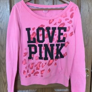 Pink sweatshirt with cheetah print.